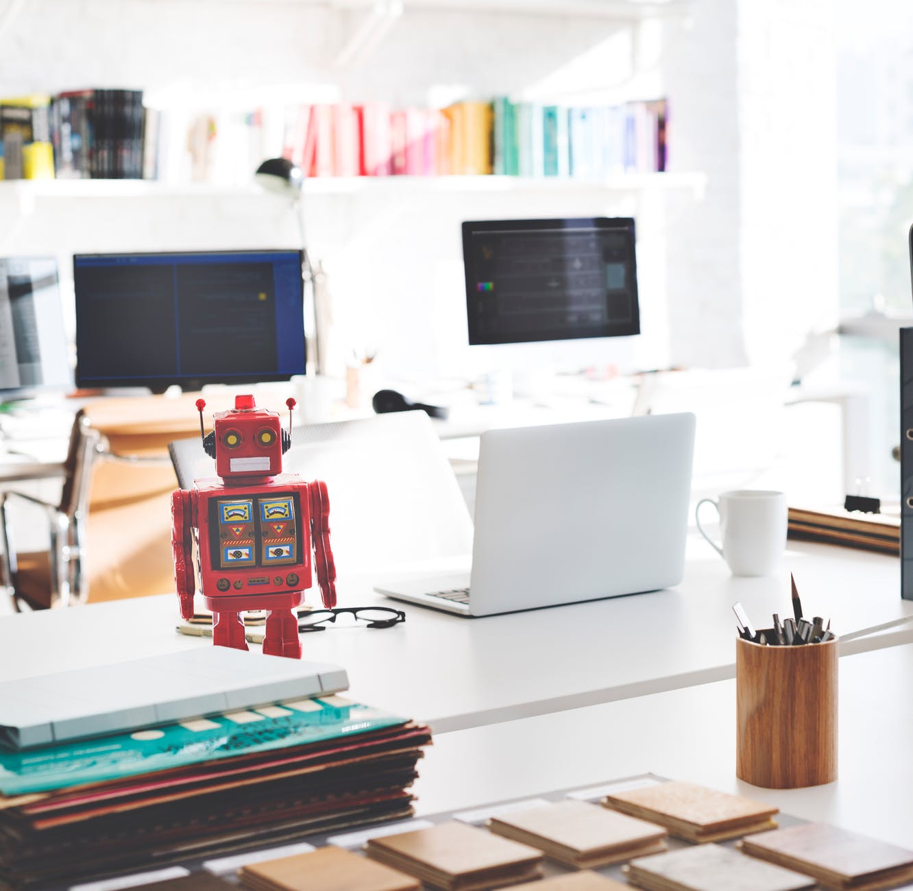 white laptop computer on white desk